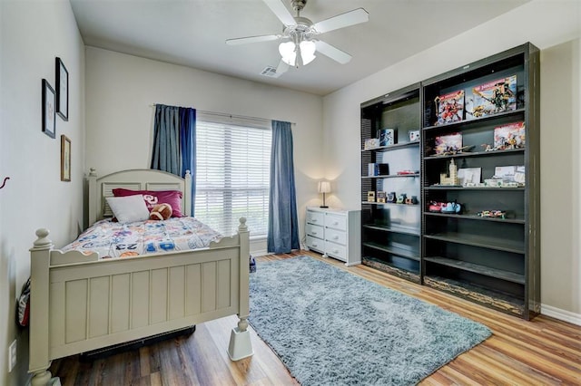 2209 Cedar Pointe Ct, Edmond, OK 73003 - bedroom with wood finished floors and ceiling fan