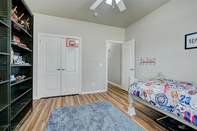2209 Cedar Pointe Ct, Edmond, OK 73003 - bedroom featuring wood finished floors, ceiling fan, and a closet