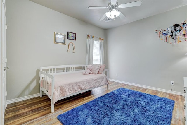 2209 Cedar Pointe Ct, Edmond, OK 73003 - bedroom featuring light wood finished floors and ceiling fan
