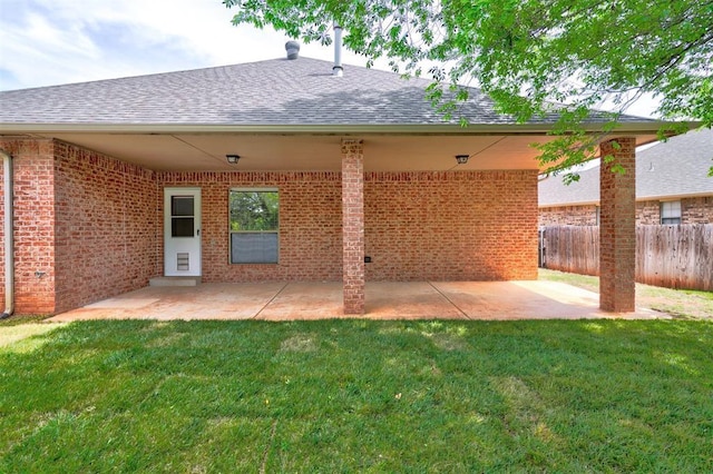 2209 Cedar Pointe Ct, Edmond, OK 73003 - rear view of house with a shingled roof, brick siding, and a patio