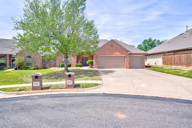 2209 Cedar Pointe Ct, Edmond, OK 73003 - view of front of house with brick siding, a garage, concrete driveway, and a shingled roof