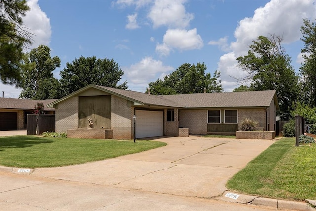 5409 NW 64th St, Warr Acres, OK 73132 - view of front of property with concrete driveway, a garage, brick siding, and a front lawn