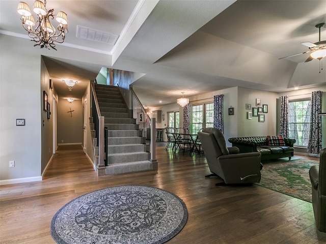 402 Hunters Ct, Edmond, OK 73034 - living room with a chandelier, wood finished floors, healthy amount of natural light, and ornamental molding