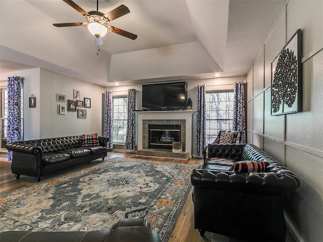 402 Hunters Ct, Edmond, OK 73034 - living area featuring wood finished floors, healthy amount of natural light, and ceiling fan