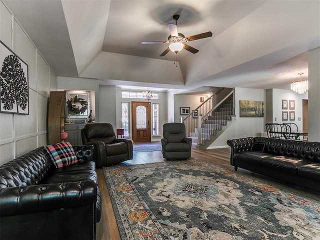 402 Hunters Ct, Edmond, OK 73034 - living area featuring a chandelier, wood finished floors, stairs, and a ceiling fan