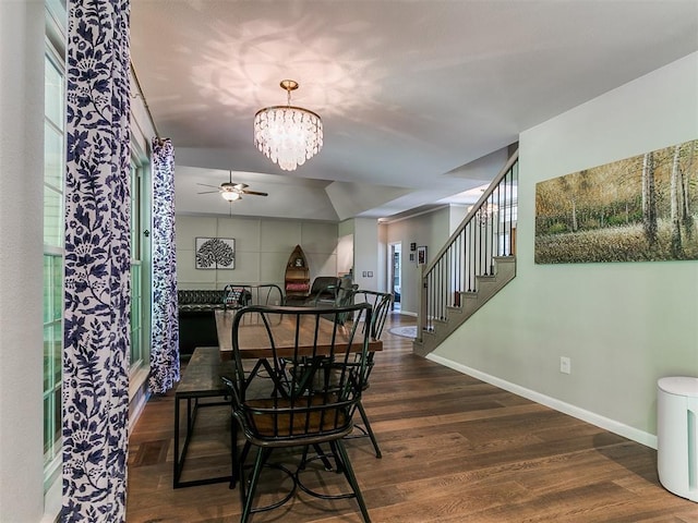 402 Hunters Ct, Edmond, OK 73034 - dining room featuring ceiling fan, wood finished floors, a chandelier, stairway, and plenty of natural light