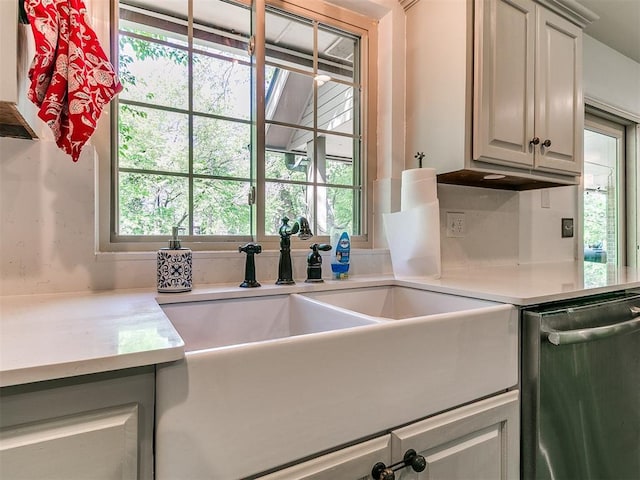 402 Hunters Ct, Edmond, OK 73034 - kitchen featuring dishwasher and light countertops