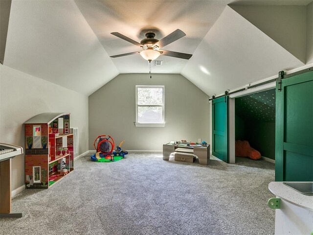 402 Hunters Ct, Edmond, OK 73034 - rec room with ceiling fan, vaulted ceiling, carpet flooring, and a barn door