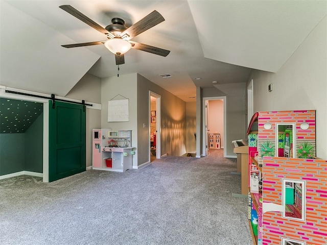 402 Hunters Ct, Edmond, OK 73034 - rec room with a barn door, ceiling fan, and carpet floors