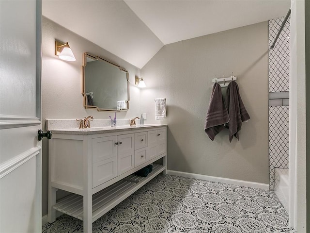 402 Hunters Ct, Edmond, OK 73034 - full bathroom featuring double vanity and vaulted ceiling