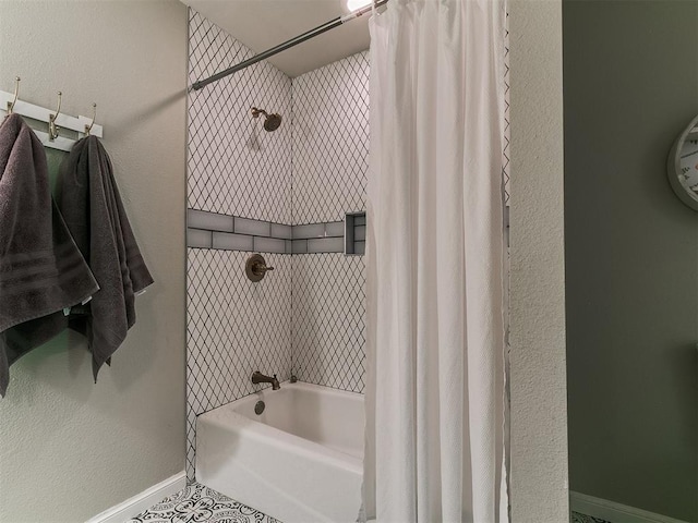 402 Hunters Ct, Edmond, OK 73034 - full bathroom featuring shower / bath combo with shower curtain and tile patterned flooring