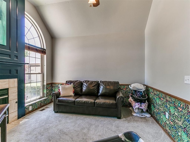 402 Hunters Ct, Edmond, OK 73034 - carpeted living room with vaulted ceiling and plenty of natural light