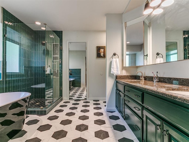 402 Hunters Ct, Edmond, OK 73034 - bathroom with a shower stall, double vanity, a soaking tub, and tile patterned floors