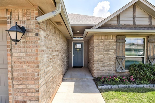 4004 Brougham Way, Oklahoma City, OK 73179 - view of exterior entry with brick siding and a shingled roof