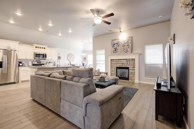 4004 Brougham Way, Oklahoma City, OK 73179 - living area with ceiling fan, light wood-style floors, a fireplace, and recessed lighting