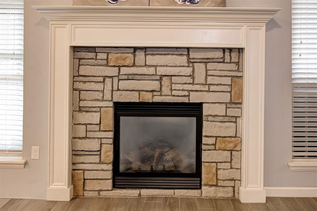 4004 Brougham Way, Oklahoma City, OK 73179 - detailed view of wood finished floors and a stone fireplace