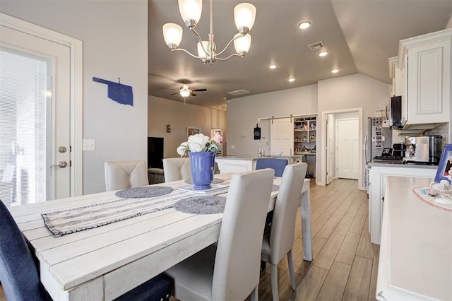 4004 Brougham Way, Oklahoma City, OK 73179 - dining space featuring light wood-type flooring, a ceiling fan, and a chandelier