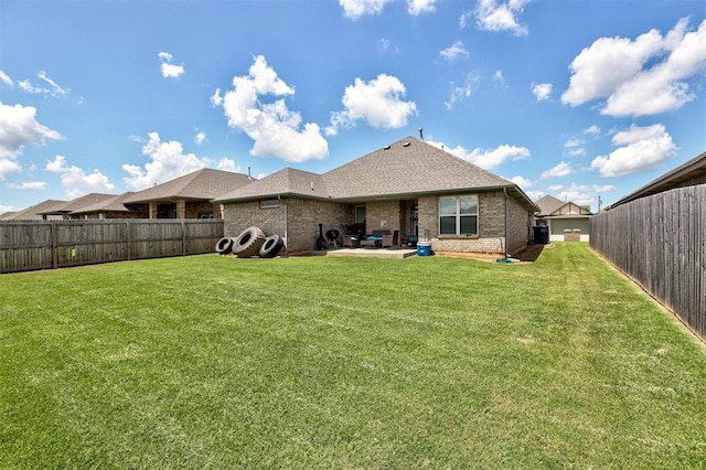 4004 Brougham Way, Oklahoma City, OK 73179 - rear view of property with brick siding, a fenced backyard, a shingled roof, and a patio area