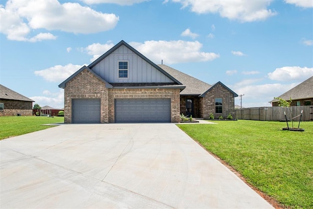 4204 Chesterfield Pl, Oklahoma City, OK 73179 - view of front facade featuring board and batten siding, brick siding, driveway, and a garage