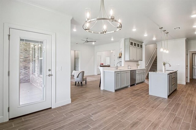 4204 Chesterfield Pl, Oklahoma City, OK 73179 - kitchen featuring a chandelier, gray cabinetry, dishwasher, crown molding, and light wood-type flooring