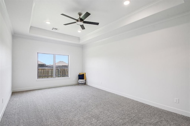 4204 Chesterfield Pl, Oklahoma City, OK 73179 - spare room with a tray ceiling, carpet floors, crown molding, a ceiling fan, and recessed lighting