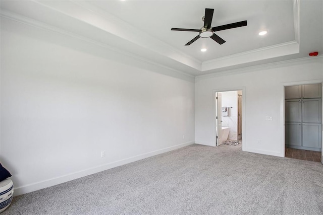 4204 Chesterfield Pl, Oklahoma City, OK 73179 - unfurnished bedroom with crown molding, a tray ceiling, carpet floors, recessed lighting, and connected bathroom