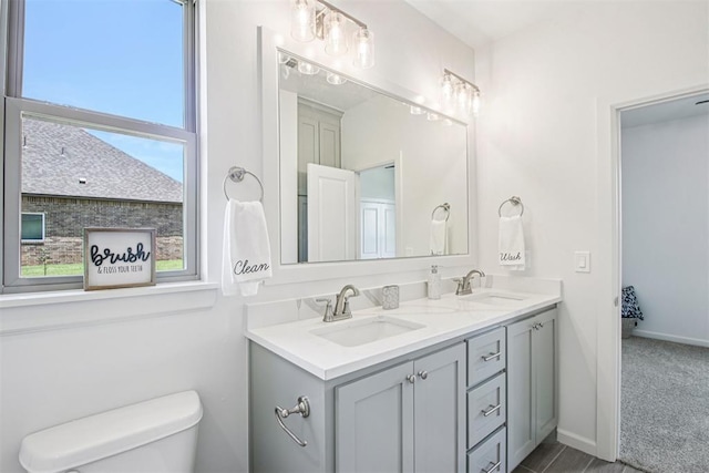 4204 Chesterfield Pl, Oklahoma City, OK 73179 - bathroom featuring healthy amount of natural light and double vanity