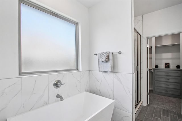 4204 Chesterfield Pl, Oklahoma City, OK 73179 - bathroom with a freestanding bath, a spacious closet, and a shower stall