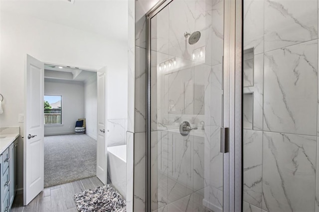 4204 Chesterfield Pl, Oklahoma City, OK 73179 - bathroom featuring a marble finish shower, vanity, and wood finished floors