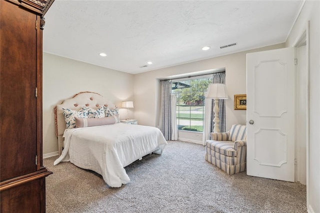 carpeted bedroom featuring recessed lighting