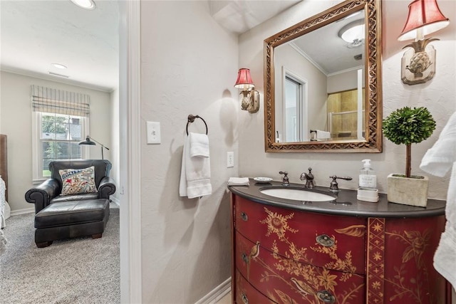 bathroom featuring vanity, ornamental molding, and recessed lighting