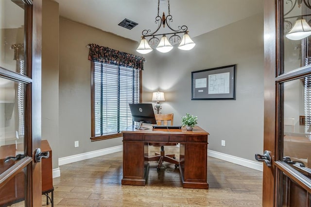405 Kingsgate Rd, Yukon, OK 73099 - office area with wood finished floors and plenty of natural light