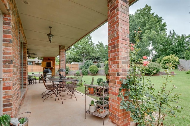 405 Kingsgate Rd, Yukon, OK 73099 - view of patio / terrace with outdoor dining area and an outdoor brick fireplace