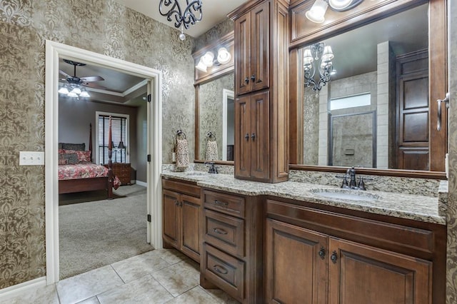 405 Kingsgate Rd, Yukon, OK 73099 - full bathroom featuring double vanity, ceiling fan, ensuite bath, tiled shower, and tile patterned floors