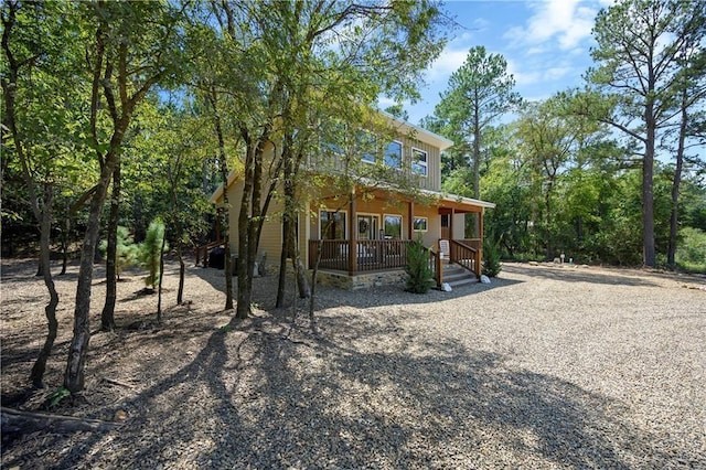 944 Camp Ranch Rd, Broken Bow, OK 74728 - back of house featuring a porch