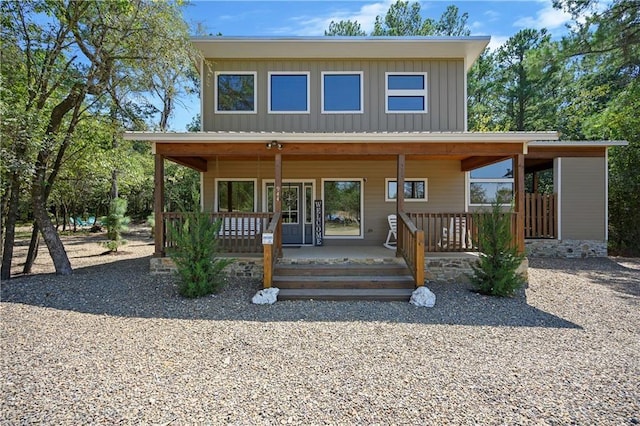 944 Camp Ranch Rd, Broken Bow, OK 74728 - view of front of property with board and batten siding and covered porch