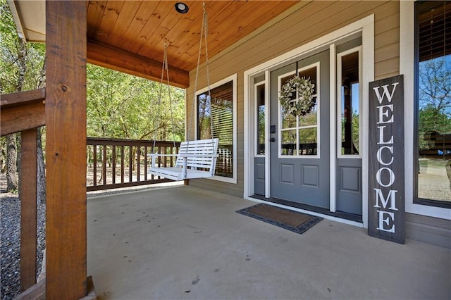 944 Camp Ranch Rd, Broken Bow, OK 74728 - doorway to property featuring a porch