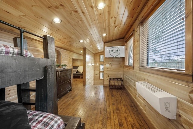 944 Camp Ranch Rd, Broken Bow, OK 74728 - bedroom featuring hardwood / wood-style flooring, wooden walls, wooden ceiling, heating unit, and recessed lighting