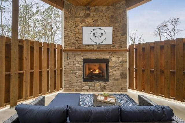 944 Camp Ranch Rd, Broken Bow, OK 74728 - view of patio / terrace with an outdoor living space with a fireplace