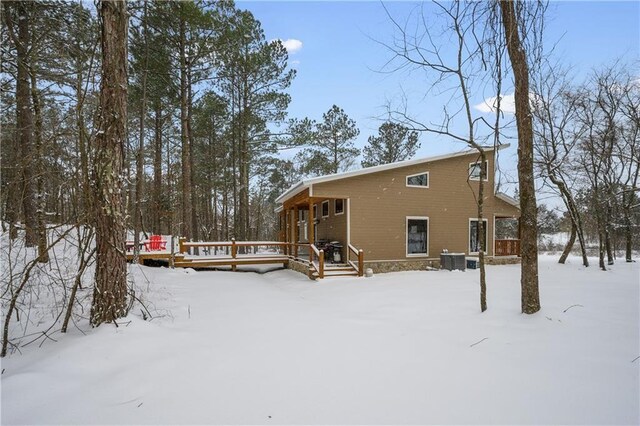 944 Camp Ranch Rd, Broken Bow, OK 74728 - snow covered house featuring a deck