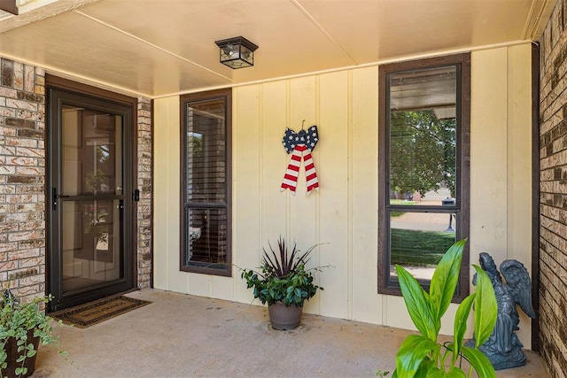 2408 Shady Tree Ln, Edmond, OK 73013 - property entrance with board and batten siding and a porch