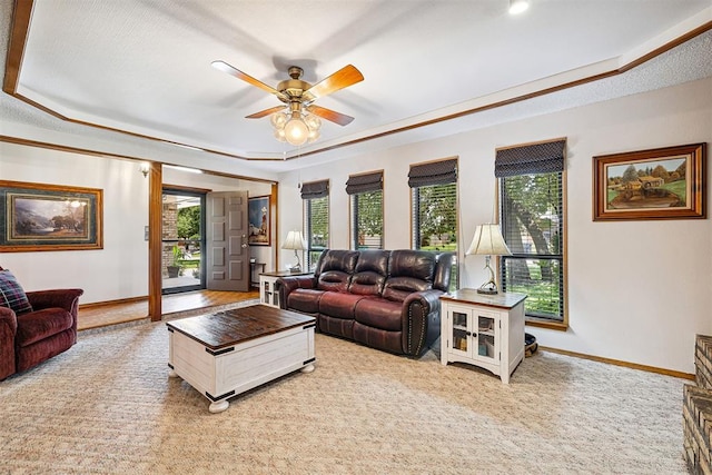 2408 Shady Tree Ln, Edmond, OK 73013 - living area featuring a tray ceiling, plenty of natural light, and ceiling fan