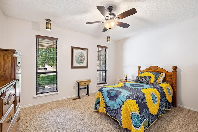 2408 Shady Tree Ln, Edmond, OK 73013 - carpeted bedroom with a textured ceiling and ceiling fan