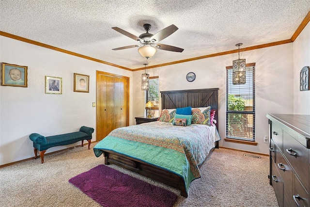 2408 Shady Tree Ln, Edmond, OK 73013 - bedroom featuring carpet flooring, a textured ceiling, crown molding, and a ceiling fan