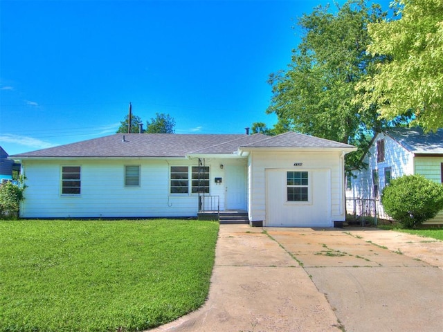 3320 NE 14th St, Oklahoma City, OK 73117 - ranch-style home featuring a front yard and concrete driveway