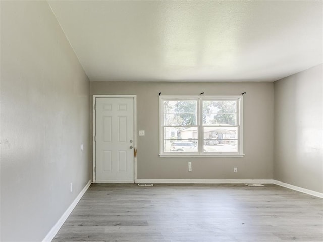 3320 NE 14th St, Oklahoma City, OK 73117 - foyer entrance featuring wood finished floors and baseboards