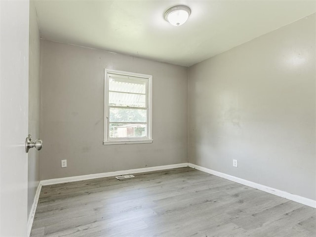 3320 NE 14th St, Oklahoma City, OK 73117 - unfurnished room featuring wood finished floors