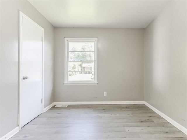 3320 NE 14th St, Oklahoma City, OK 73117 - unfurnished room featuring light wood finished floors and baseboards