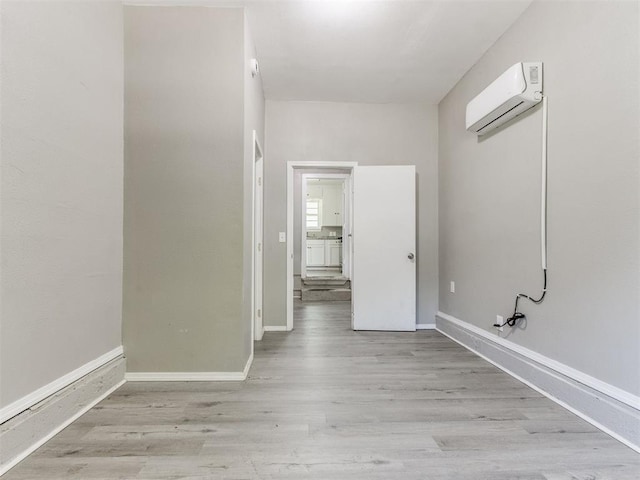 3320 NE 14th St, Oklahoma City, OK 73117 - corridor featuring a wall mounted AC and wood finished floors