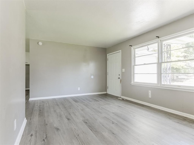 3320 NE 14th St, Oklahoma City, OK 73117 - foyer entrance with light wood finished floors and baseboards